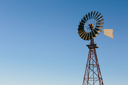 Windmill on a blue sky background