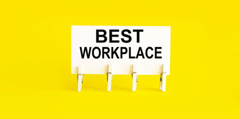 text BEST WORKPLACE on white short note paper yellow background