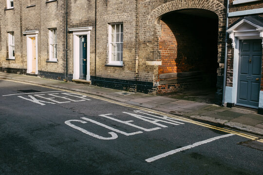 Keep clear road sign in a street of terraced houses. Kings Lynn, Norfolk, UK.