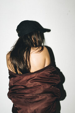 Woman in Hat & Bomber Jacket