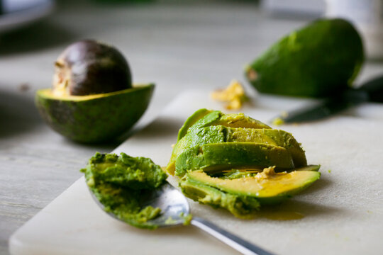 Sliced avocado on a chopping board.