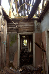 Ruins of an old wooden abandoned house.