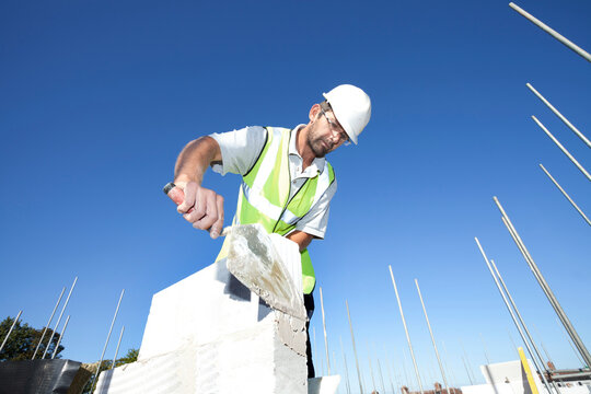 Bricklayer on construction site.