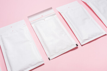 Set of white paper bubble envelopes for postal shipping