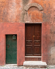 vintage house front entrance green and brown doors, Rome Italy