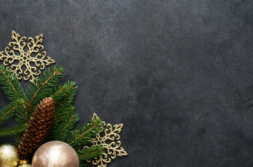 Obraz na płótnie Canvas New Year card. Christmas diction with fir and balls on a black background.