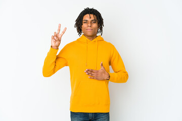 Young african american rasta man taking an oath, putting hand on chest.