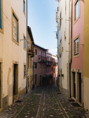 Naklejka na ściany i meble The narrow streets in Alfama in Lisbon. Autumn 2019.