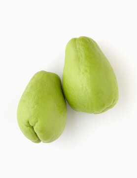 two chayotes on white background