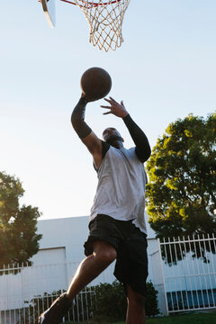 Street baller going up for a layup