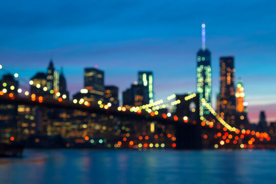 New York City - Defocused Lights of the Brooklyn Bridge and Lower Manhattan Skyline