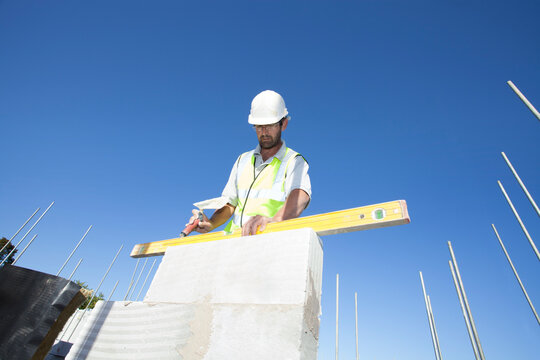 Bricklayer on construction site.