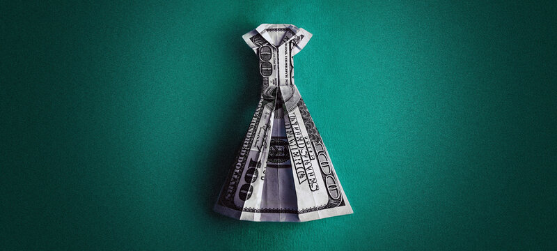 Origami dollar dress on a green background