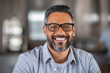 Smiling indian man looking at camera - Powered by Adobe