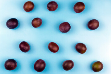 Plums on a blue background