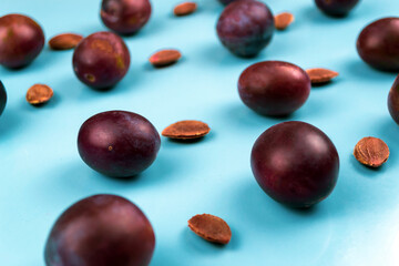 Plums on a blue background