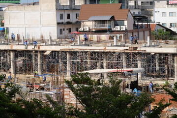 construction workers working on large buildings
