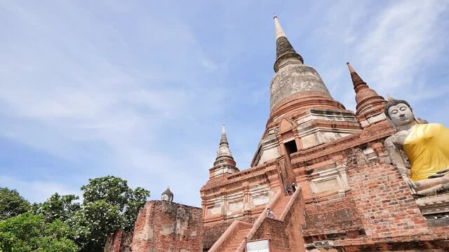 Old buddha statue and pagoda ,temple in Ayutthaya Historical Park. Wat Yai Chaimongkol, Ayutthaya province, Thailand.
