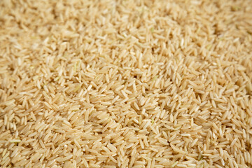 Dry Brown Rice background, side view.