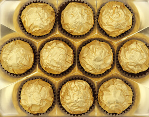 Ten chokolate candies in a box
