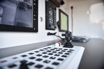 Surveillance equipment control panel photo with focus on joystick controller