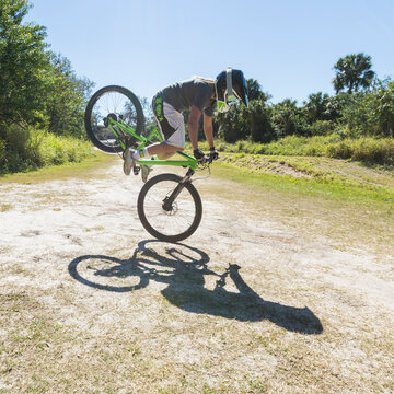 Mountain biker up on front wheel