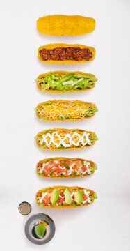 Series Of Hard Shell Tacos Being Built