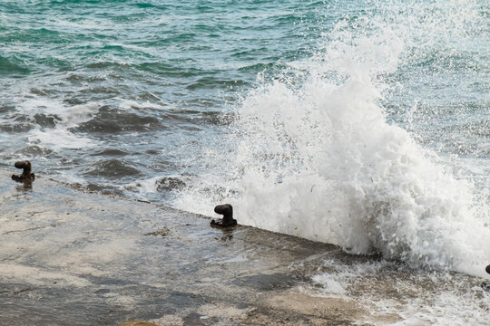 Wave hitting a dock