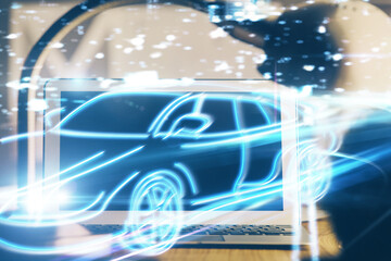 Naklejka premium Desktop computer background in office with automobile hologram drawing. Multi exposure. Tech concept.