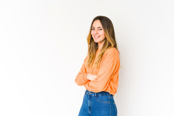 Young caucasian woman isolated on white background happy, smiling and cheerful.