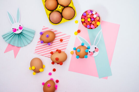 Colourful and Pastel Easter Eggs Decorated With Pompons