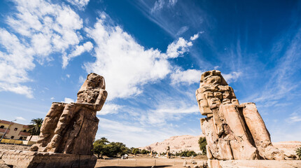 The Colossi of Memnon are two giant stone statues of Pharaoh Amenhotep III. Luxor, West Bank, Egypt