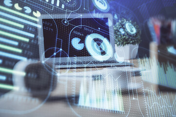 Double exposure of desktop computer and technology theme hologram. Concept of software development.