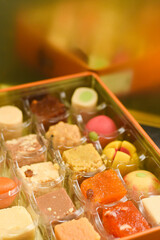 Indian sweets, Diwali sweets mithai milk Peda and Halwa or Halva, flavored variety of assorted dessert in box to gift on Deepavali, Pongal, Durga Pooja, Holi, Diwali festival in India.