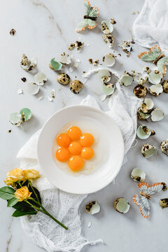 Quail eggs, butterflies and flower