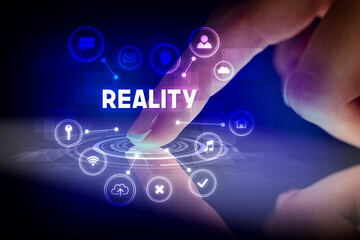 Fototapeta premium Finger touching tablet with web technology icons and REALITY inscription, web technology concept