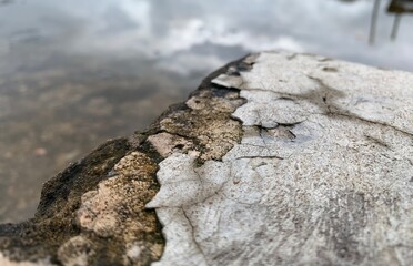 broken wall and sky reflection on rain water