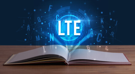 LTE inscription coming out from an open book, digital technology concept