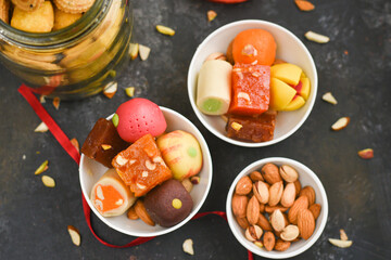 Indian sweets, Diwali sweets mithai milk Peda and Halwa or Halva, flavored variety of assorted dessert served as gift on Deepavali, Pongal, Dussehra, Durga Pooja, Holi, Diwali festival in Delhi India.