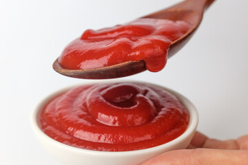 Tomato ketchup on white background
