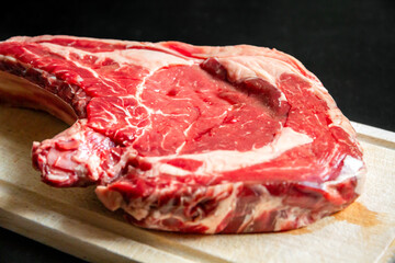 Beef prime rib on a cutting board