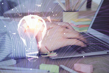 Growing arrows with businessman working on computer on background. Success concept. Double exposure.