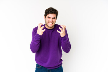 Young man isolated on white background upset screaming with tense hands.