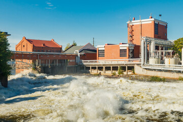 Kouvola, Finland - 15 September 2020: Old red brick buildings of Upm factory on rapids Kuusankoski.