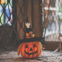 Halloween pumpkin. Not glowing Jack-o-lantern props for Halloween party (light off). Vintage filter.