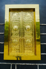Arabic calligraphy gold carving on the door of the Kaaba Mecca