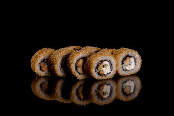 Fresh delicious beautiful sushi rolls on a dark background