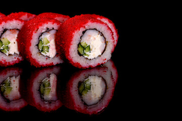 Fresh delicious beautiful sushi rolls on a dark background
