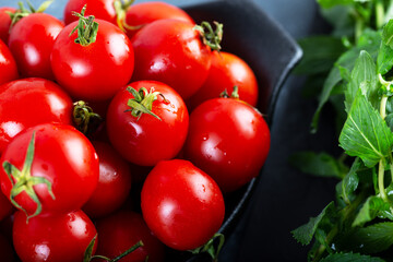 Washed fresh cherry tomatoes with fresh mint.