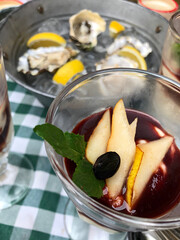 cream with fruits. delicious bright breakfast - dessert with fruits - pears and jam. Oysters with lemon on ice